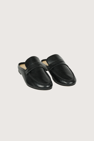 front profile  Penny Mule Black leather Backless version of Jamie Haller's classic Penny Loafer
Slip on ease
Handmade in Italian Bufalini
Sizing is the same as the classic Penny Loafer