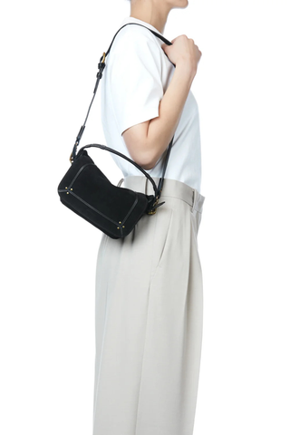 side profile model wearing on shoulder Pepito S Noir suede Bag Shoulder bag, 
Quilted leather handle
Long adjustable, removable strap 
Zippered exterior pocket at the back of the bag
80% Calfskin 20% Goatskin / Lining 100% Cotton