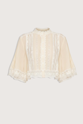 flat lay Pippa Solid Short Sleeve Top Short sleeve
Softly raised neckline
Delicate pleating
Lace inserts throughout
Cropped silhouette
Floral lace hem
Airy, flowing sleeves
100% cotton
Button front