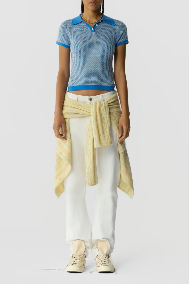 front profile model wearing Pique Shrunken Short Sleeve Polo Cashmere blue FINE WEIGHT PIQUE STITCH POLO
RIB POLO COLLAR
THREE BUTTON HALF PLACKET CLOSURE
RIB HEM AND CUFF TRIM
FINE TWO COLOR TEXTURE PIQUE STITCH
GIR BRANDING AT BACK NECK