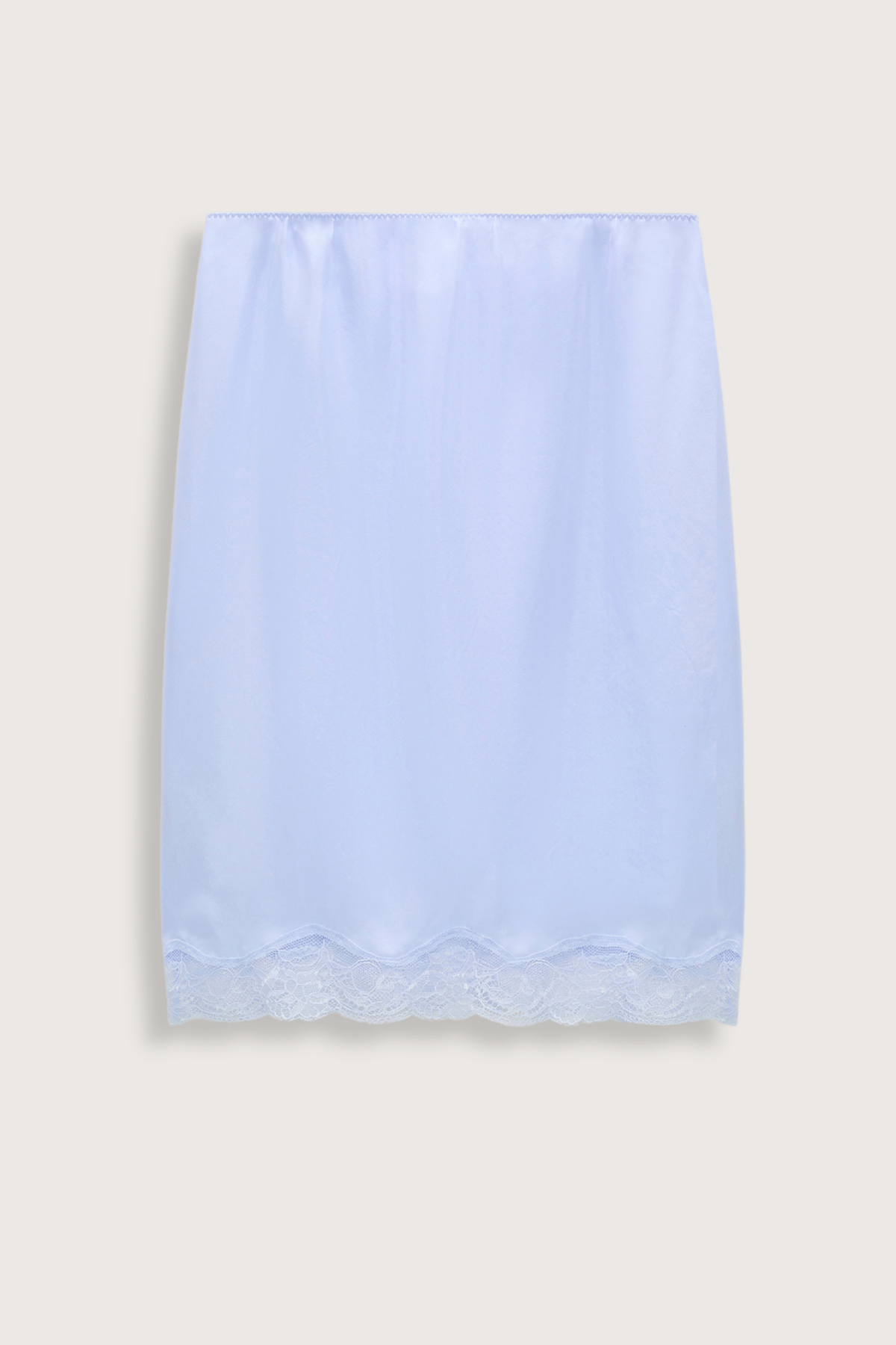 flat lay Playful Volumes Skirt Icy Sky blue Lingerie-inspired skirt

Scalloped lace trim around the hemline
100 % Silk
Double layer silk Habotai lingerie-style skirt
Lace hem with scalloped edge
Silk Habotai lining with lace detail