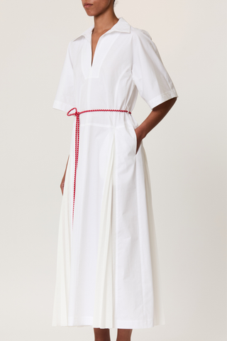 side profile model wearing  Pleated Poplin Dress With Red Belt white popeline long shirt dress
V-neck
Belt included