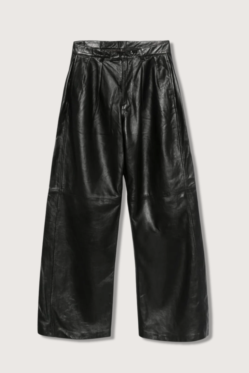 flat lay Pleated Wide Leather Pant black Pleated wide leg leather pant
This style runs large. We recommend sizing down.
100% Sheep Leather and Polyester Lining
