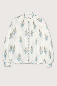 flat lay Poet Sky Mist Flower Blouse off white cotton Loose fit
Ruffled collar
Dramatically gathered sleeves
Slightly sheer
Hand-block-printed with signature falling floral motif
Border-print placket
Block-printed by hand