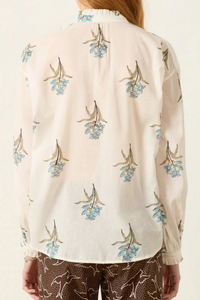 back profile model wearing Poet Sky Mist Flower Blouse off white cotton Loose fit
Ruffled collar
Dramatically gathered sleeves
Slightly sheer
Hand-block-printed with signature falling floral motif
Border-print placket
Block-printed by hand