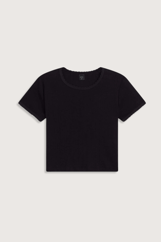 flat lay Pointelle Baby Tee Black slim fit tee
Cropped length
Cap-style sleeve
Classic crew neckline
Signature pinhole stripes
Delicate eyelets
Scalloped edging
100% Cotton