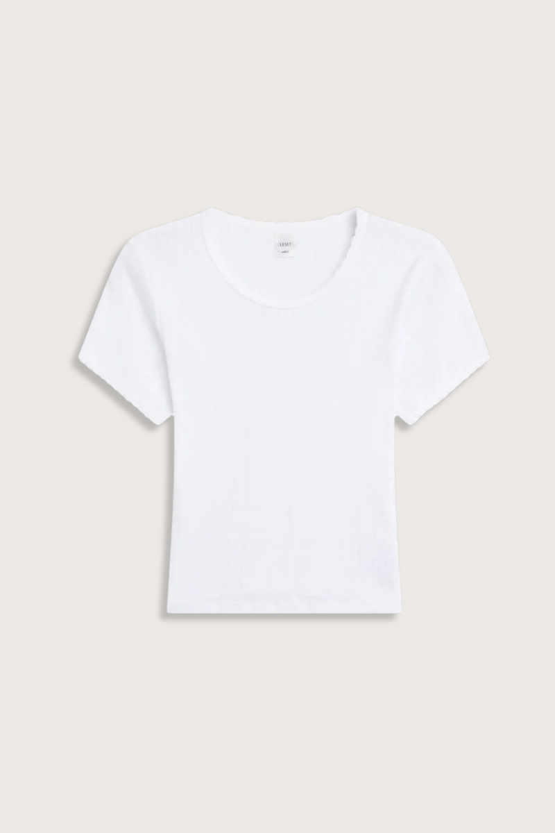 flat lay Pointelle Baby Tee White slim fit
Cropped length
Cap-style sleeve
Classic crew neckline
Signature pinhole stripes
Delicate eyelets
Scalloped edging
100% Cotton