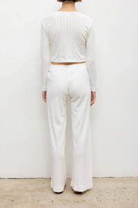 back profile model wearing Pointelle Crop Cardigan White cotton Signature pinhole stripes
Dainty eyelets
Scalloped edging