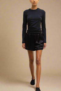 front profile model wearing Pointelle Slim Fit Long Sleeve Black cotton crewneck