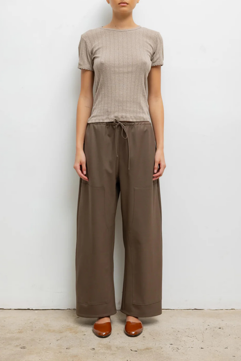 front profile model wearing Pointelle Slim Fit Tee Beige cotton Classic lingerie inspired details
Pinhole stripes
Eyelets
Scalloped edges
100% Cotton