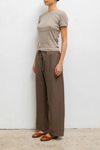 side profile model wearing Pointelle Slim Fit Tee Beige cotton Classic lingerie inspired details
Pinhole stripes
Eyelets
Scalloped edges
100% Cotton