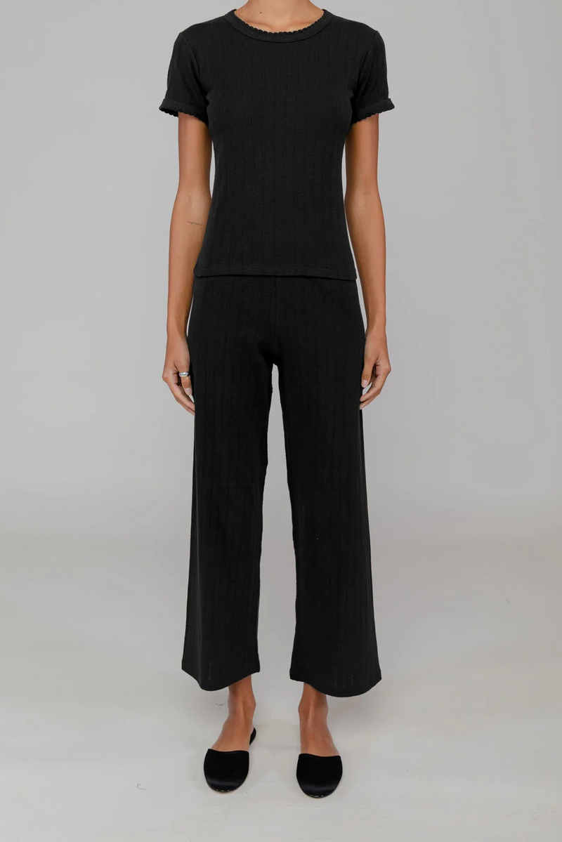 front profile model wearing Pointelle Slim Fit Tee Black cotton crewneck