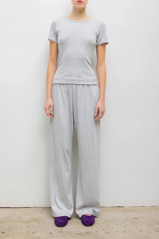 front profile model wearing Pointelle Slim Fit Tee Light Grey Melange 
Pinhole stripes
Eyelets
Scalloped edges
100% Cotton