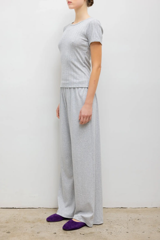 side profile model wearing Pointelle Slim Fit Tee Light Grey Melange 
Pinhole stripes
Eyelets
Scalloped edges
100% Cotton