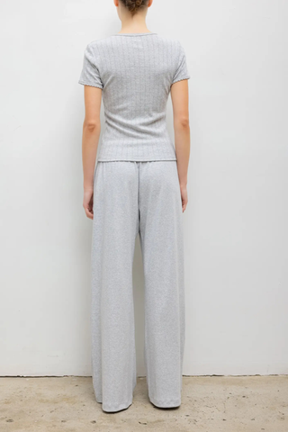 back profile model wearing Pointelle Slim Fit Tee Light Grey Melange 
Pinhole stripes
Eyelets
Scalloped edges
100% Cotton