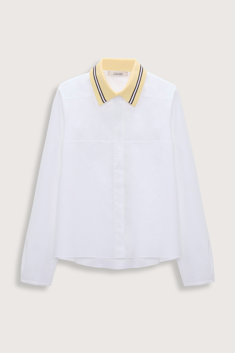 flat lay Poplin Power Blouse white with Lemon Knit white Contrast color striping
96 % Cotton, 4 % Elastane
A-line cotton poplin shirt with removable collar
Knit polo collar
Raw finish cuffs