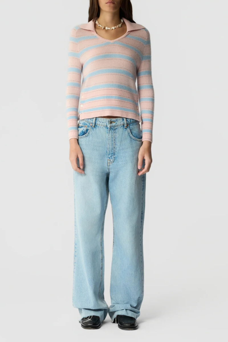 front profile model wearing Port Polo Cashmere With Side Button Powder Pink Combo LIGHT-WEIGHT TEXTURED STRIPE POLO
V NECK WITH POLO COLLAR
COLLAR TIPPED IN CONTRAST COLOR
SHRUNKEN FIT WITH 3/4 LENGTH SLEEVES
HIGH RIB HEM WITH THREE BUTTON SIDE VENT
BACK NECK GIR BRANDING