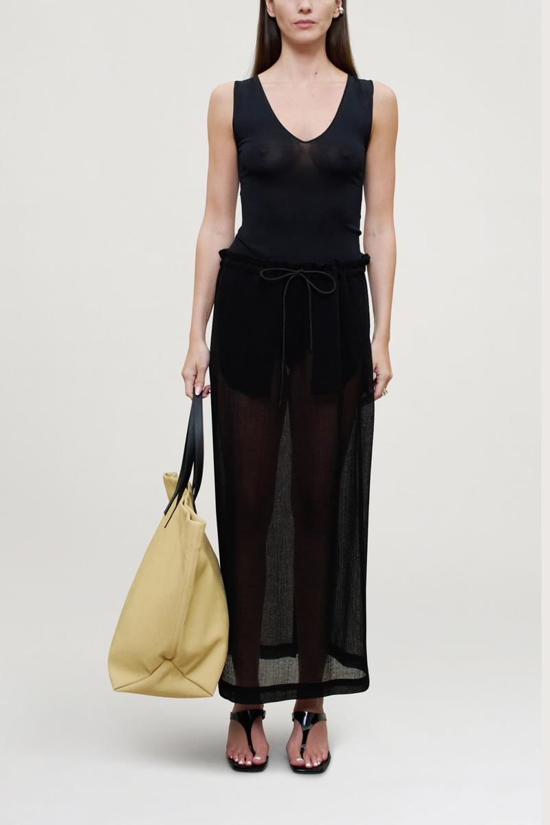 front profile model wearing  Portia V-Neck Compact Viscose Bodysuit black Sleeveless 
Close, smooth fit through the body
88% Viscose / 12% Polyamide