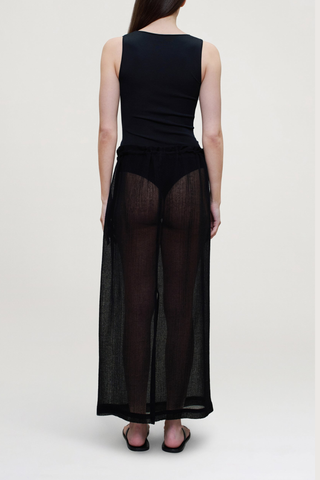 back profile model wearing  Portia V-Neck Compact Viscose Bodysuit black Sleeveless 
Close, smooth fit through the body
88% Viscose / 12% Polyamide