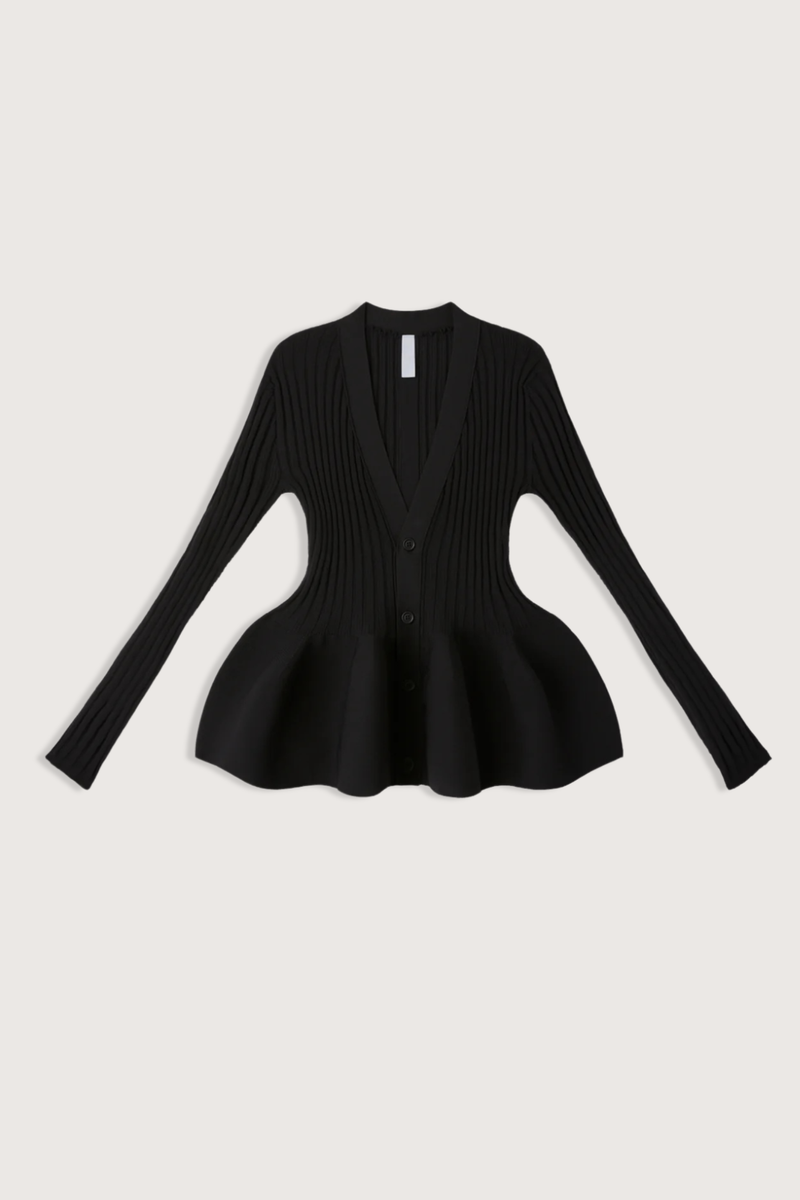 flat lay front Pottery Long Sleeve Cardigan Black Voluminous, three-dimensional flare
Form-fitting
Seamless
Button front closure
100% Polyester (Recycled Polyester)