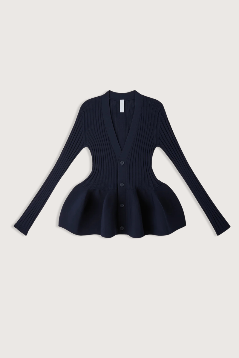 flat lay Pottery Long Sleeve Cardigan Navy Voluminous, three-dimensional flare
Form-fitting
Seamless
Button front closure
100% Polyester (Recycled Polyester)