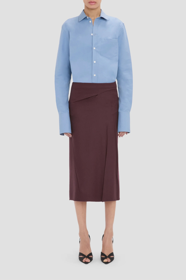front profile model wearing  Pressed Tailored Flannel Skirt Acai (Merlot) Pressed Tailored Skirt
Compact flannel
Fabric is pressed for a sharp, structured finish
Fit & flare shape
Mid rise and midi length
Exposed seam detailing
100% Virgin Wool