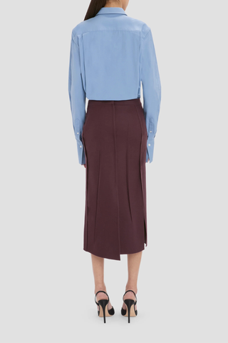 back profile model wearing  Pressed Tailored Flannel Skirt Acai (Merlot) Pressed Tailored Skirt
Compact flannel
Fabric is pressed for a sharp, structured finish
Fit & flare shape
Mid rise and midi length
Exposed seam detailing
100% Virgin Wool