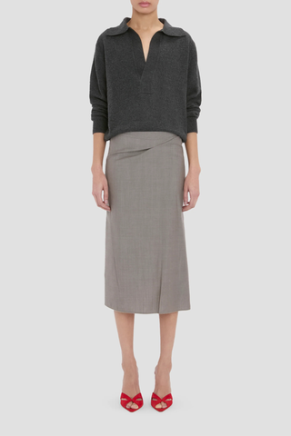 front profile model wearing Pressed Tailored Flannel Skirt Dark Grey Melange Pressed tailored
Midi skirt
Blend of wool and mohair for a textured finish
Structured fit-and-flare silhouette
Mid rise
Skirt lining
73% Virgin Wool 27% Mohair
