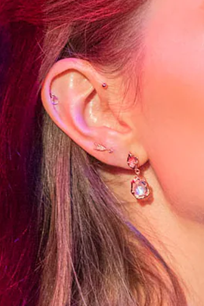 model wearing Quilted Arrow Stud earring 14k gold with diamond