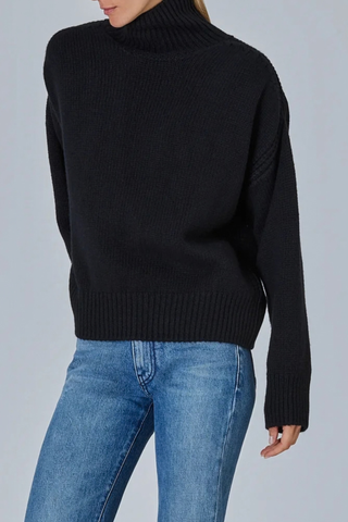 side profile model wearing Raglan High Neck With Back Slit Sweater Black Contemporary sweater
Tall ribbed neck
Teardrop back slit
Soft raglan lines
Rib structure
Slightly oversized fit
Crafted stitch details
100% cashmere