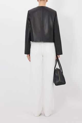 back profile model wearing Raho Leather Jacket Black Soft plongé lambskin leather
Slightly cropped
Boxy fit
Crew neck
Long sleeves
Four-button placket.