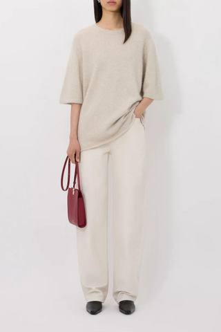 front profile model wearing Raven Short Sleeve Wool/Yak Blend Sweater Stone Melange straight fit crewneck