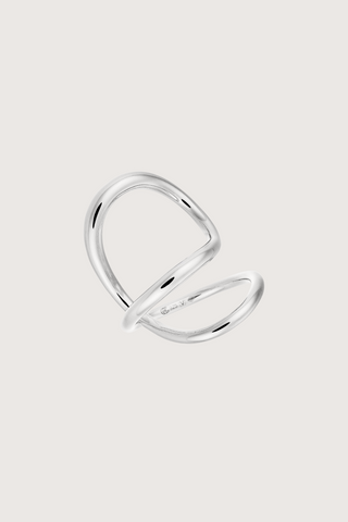 flat lay Ribbon Ring sterling Silver curving around the finger