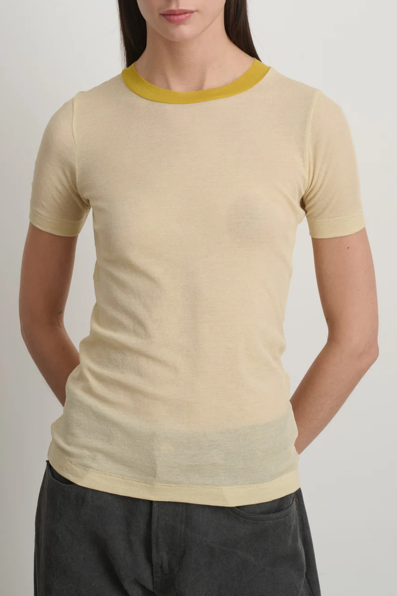 front profile model wearing Ringer Crepe Jersey Tee Light Yellow/Yellow cotton Luxe second skin short sleeve crew neck fit
Thick contrast collar
Set-in sleeves
Raw finishing details