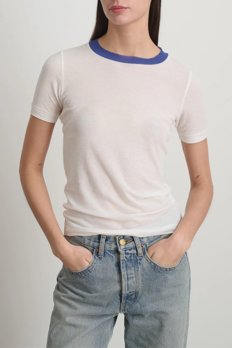 front profile model wearing Ringer Crepe Jersey Tee White/Blue cotton Luxe second skin short sleeve crew neck fit
Thick contrast collar
Set-in sleeves
Raw finishing details