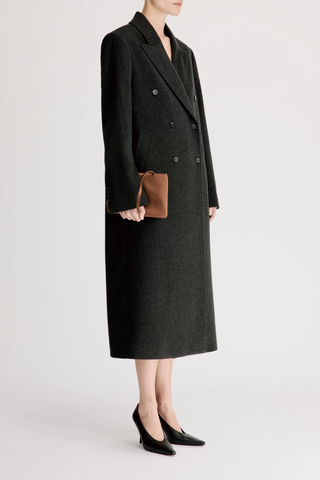 side profile model wearing Rosco Loro Piana Blend Long Coat Anthracite grey Loro Piana fabric
Double breasted opening
Peak lapels
Side seam pockets
Back vent
90% Wool, 10% Cashmere