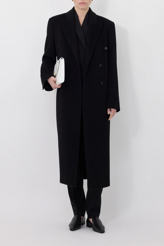 front profile model wearing Rosco Loro Piana Cashmere Blend Long black Coat double breasted