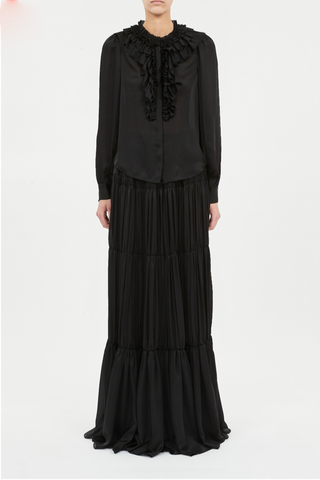 front profile model wearing Rouen Silk Ruffle Front Blouse Noir Gathered sleeves, Elegant volume, Richly layered ruffles