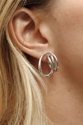 model wearing Round Trip Hoop Earrings Sold as a pair
925 Rhodium Plated Sterling Silver