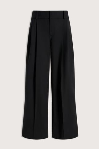 flat lay Roxana Low Rise Tropical Wool Pant black wool
Pleated trouser
Relaxed yet refined fit
double-pleated front
Side seam pockets
Two buttoned back flap pockets
Wide looped waistband
Tab waist closure for a polished finish
Tropical wool