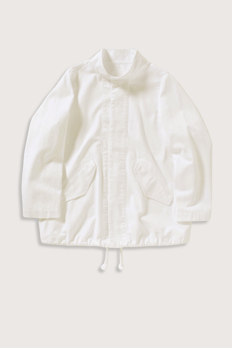 flat lay Ruth Cotton Twill Jacket Ivory Stand collar
Angled welt flap pockets
Interior drawcords at hem
Tonal button front closure
Unlined
Boxy fit