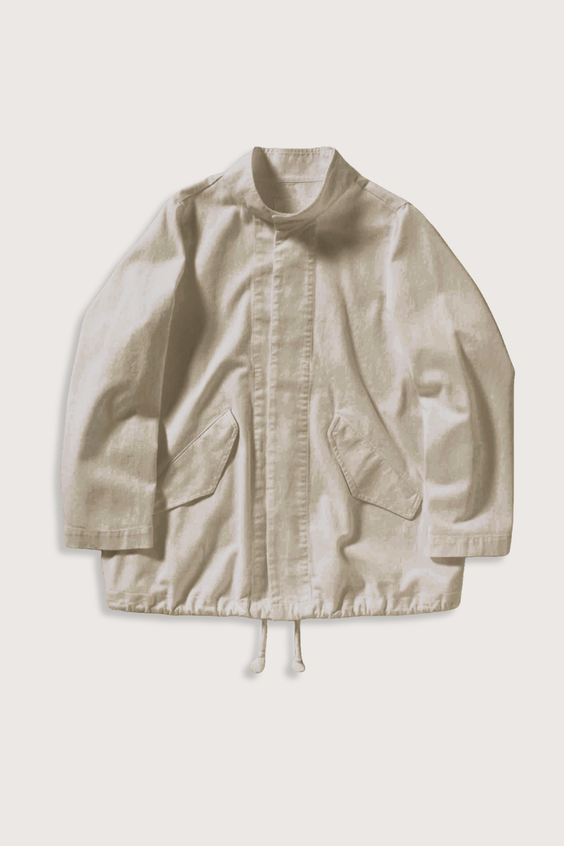 flat lay Ruth Cotton Twill Jacket Khaki Stand collar
Angled welt flap pockets
Interior drawcords at hem
Tonal button front closure
Unlined
Boxy fit