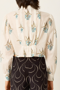 back profile model wearing Ryland Sky Mist Flower Shirt off white cotton Cropped shirt
Pleating details
Structured yet delicate shape
Slightly sheer
Hand-block-printed with signature falling floral motif
Border-print placket
Block-printed by hand