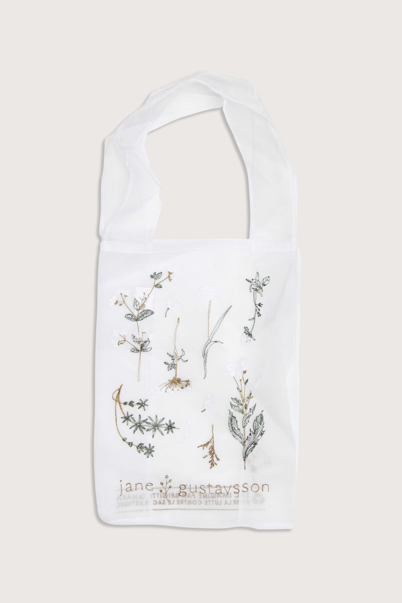flat lay Sac tote bag Elle Blanc Crafted from delicate organza
Embroidered herbarium and floral motifs
Lightweight
Subtle transparency