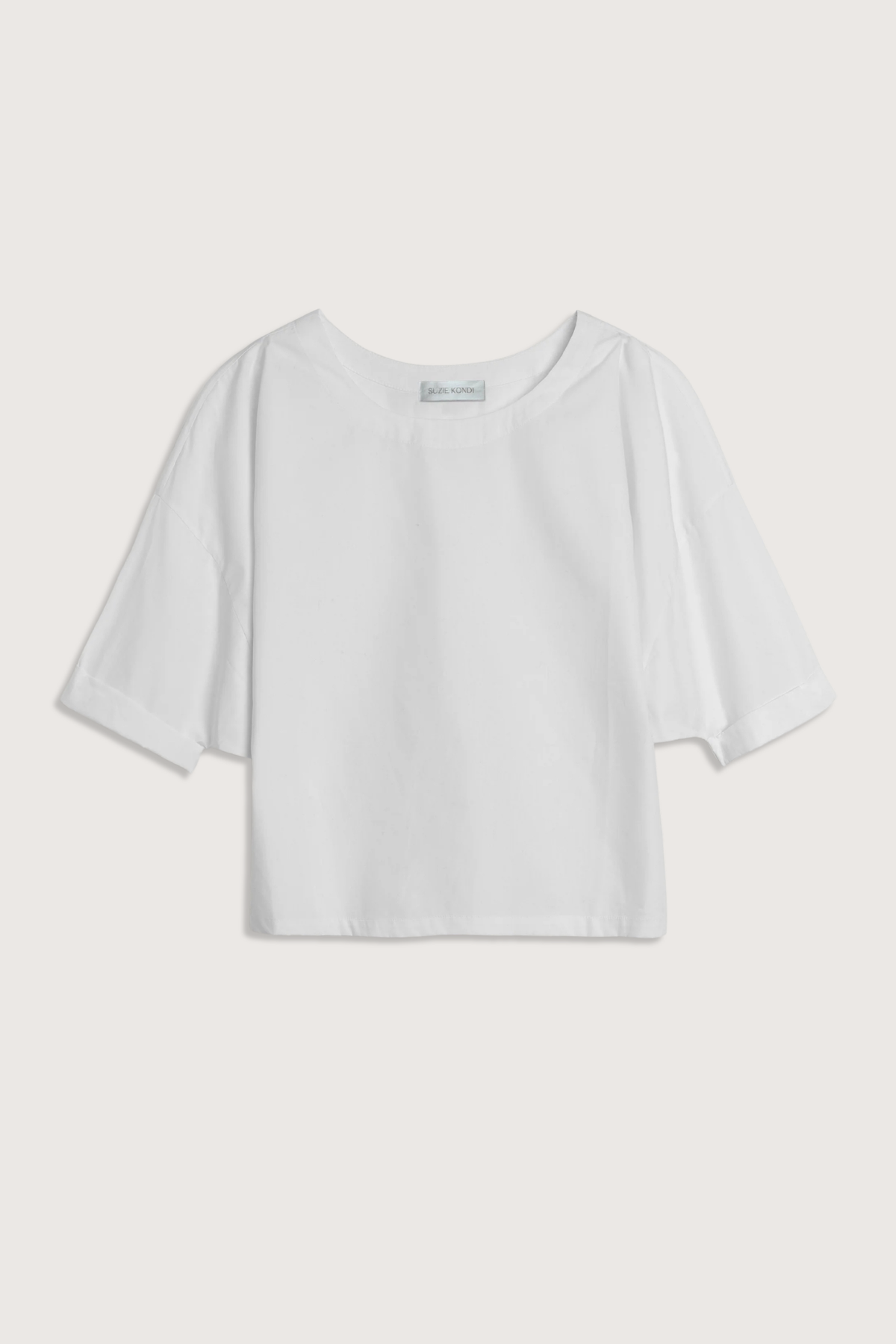 flat lay Saria Solid Poplin Top White Crew neck
Relaxed fit
Dropped shoulders
100% cotton