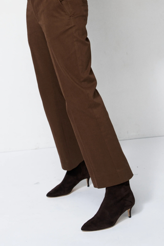 side profile model wearing Seamed Stiletto Suede Boot deep espresso brown Slim profile
Pointed toe
Baby stiletto
Ankle length boot
Italian Suede Goatskin