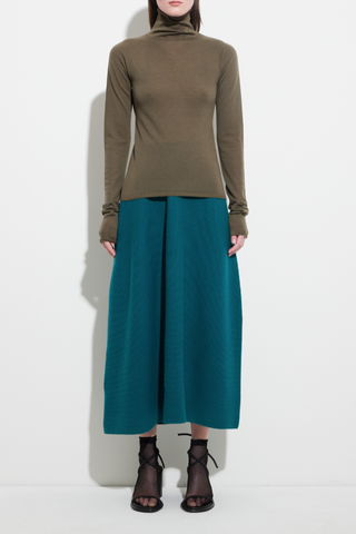 front profile model wearing Seamless Second Skin Turtleneck Top Khaki wool classic roll neck slim fit