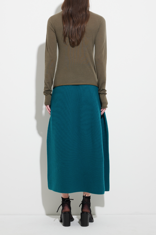 back profile model wearing Seamless Second Skin Turtleneck Top Khaki wool classic roll neck slim fit