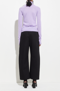 back profile model wearing Seamless Second Skin Turtleneck Top Orchid wool Classic roll-neck slim fit