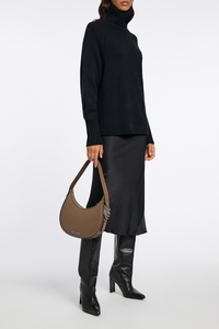 angle profile model wearing Sense Of Shine Skirt Black stretch silk midi length